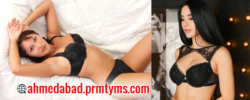 Two women in black lingerie posing, one reclining on a bed and the other standing indoors, with text 'ahmedabad.prmtyms.com' displayed.