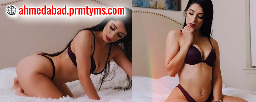 Elegant woman in maroon lingerie posing on a bed, promoting escort services in Ahmedabad.